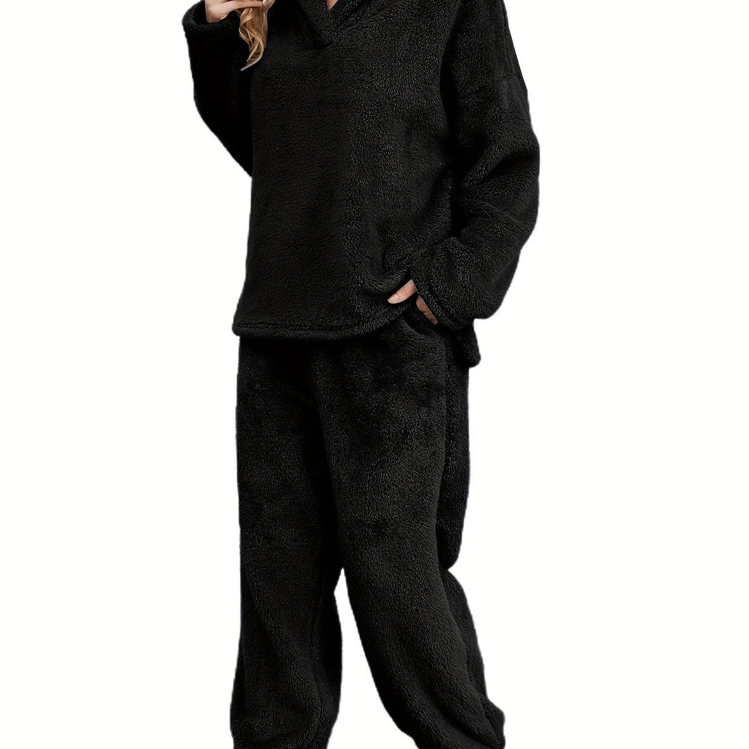 Ultra-soft women's plush coral fleece loungewear set, a warm and comfy two-piece pajama outfit.