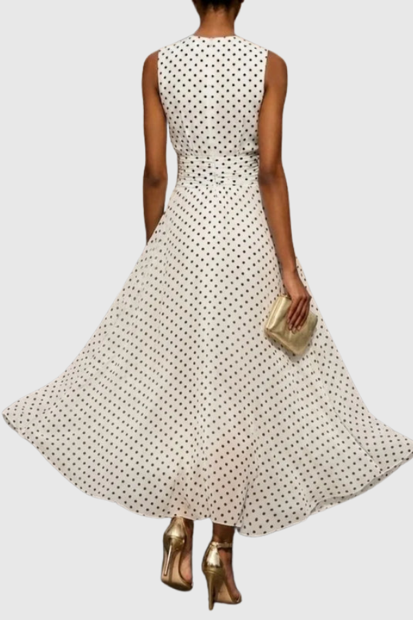 Elegant women's polka dot maxi dress featuring a stylish halter neck and keyhole detail, ideal for summer occasions.