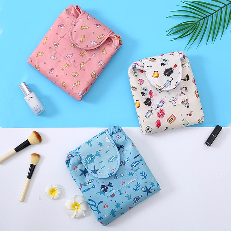 Set of two portable drawstring cosmetic bags for women, black and pink, versatile travel organizers.