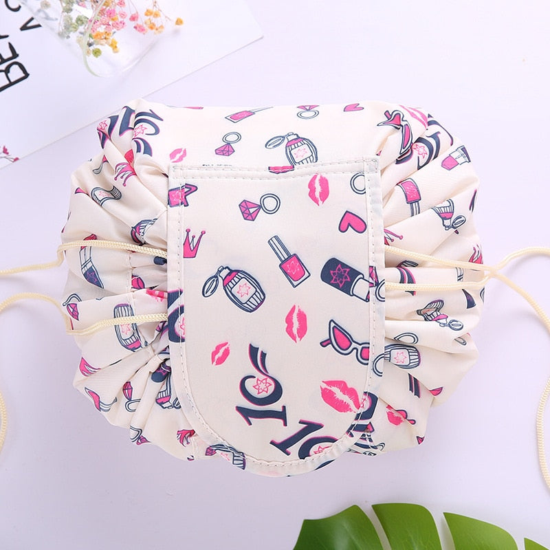 Portable drawstring cosmetic bag being packed into a suitcase, efficient travel organizer.