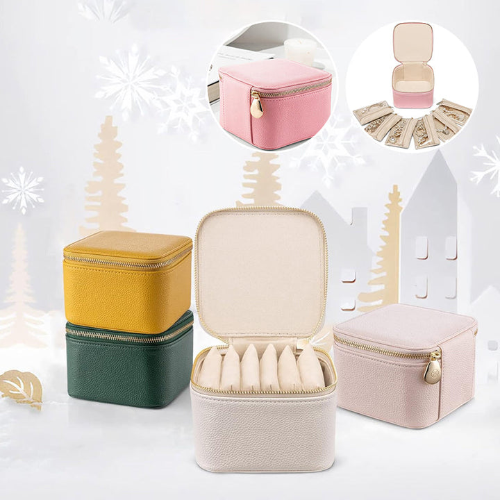 Women's portable pink leather jewelry travel case with zipper, velvet lining, and compartments