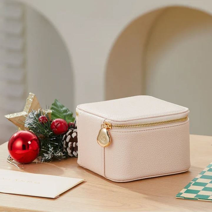 Closed portable leather jewelry travel case in rose gold, perfect for earrings, rings, necklaces