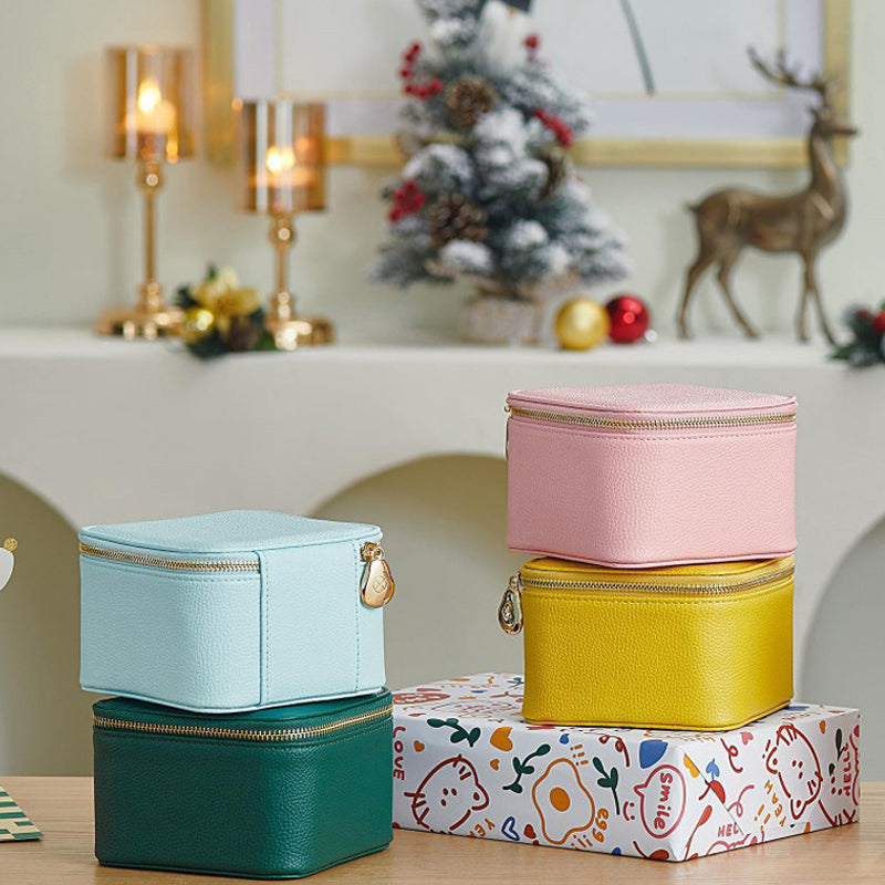 Women's travel-friendly leather jewelry box in a chic rose tone, perfect portable storage