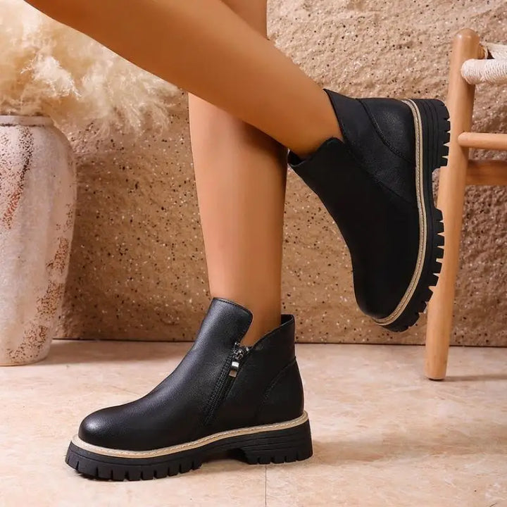 Women's fashionable leather ankle boots in a rich tan color with a practical lug sole for fall.
