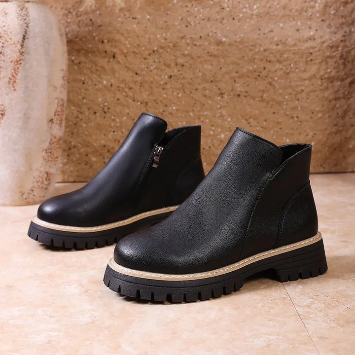 Women's comfortable ankle boots made from premium leather, featuring a trendy lug sole and easy side zip.