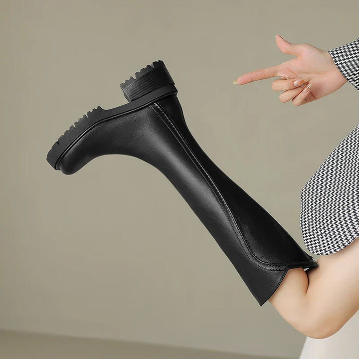 Close-up of the textured leather on women's premium orthopedic boots, highlighting craftsmanship.