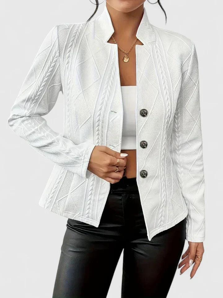 Close-up of women's premium textured stand-collar blazer, highlighting tailored fit & elegant single-breasted design.