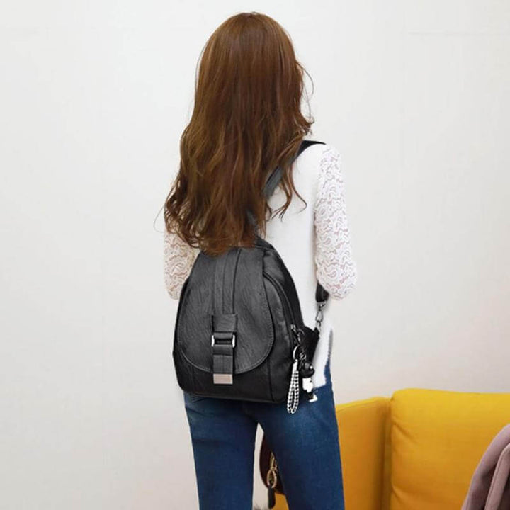 Women's versatile water-resistant leather backpack, anti-theft design for urban adventures.