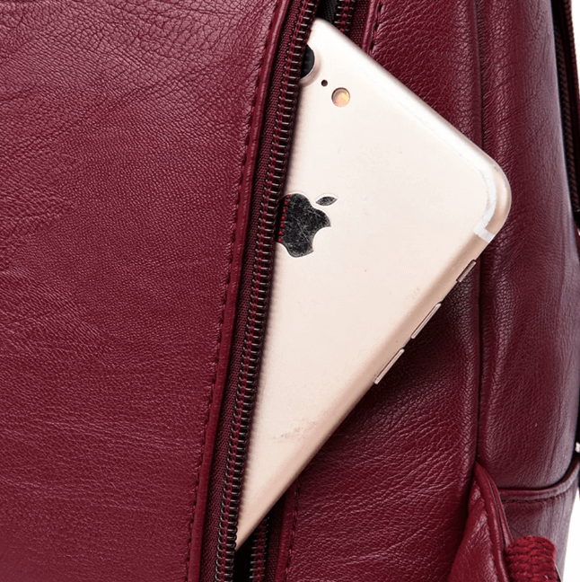 Durable women's water-resistant leather backpack for travel, featuring secure anti-theft pockets.