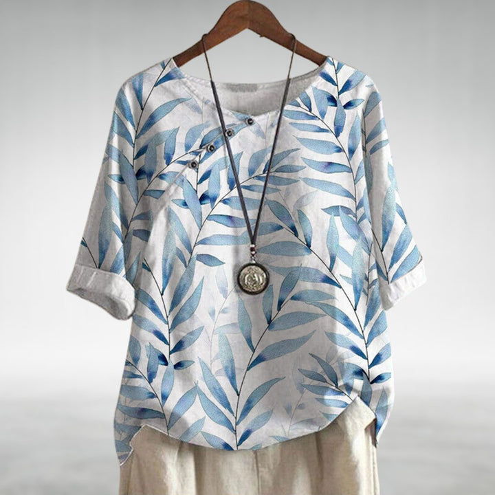 Women's printed asymmetric casual blouse, vibrant design, comfortable and stylish everyday top.