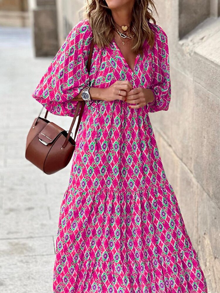 Women's long printed summer dress with a flattering waistband, a must-have for warm weather.