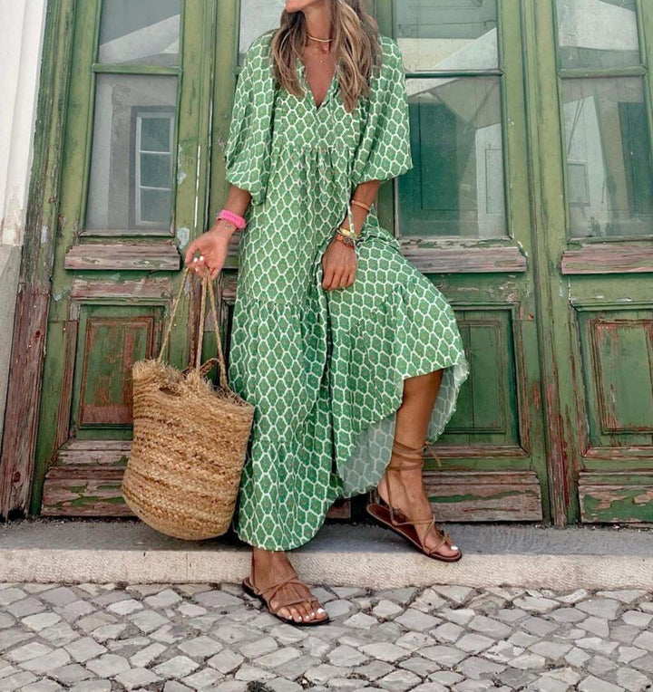 Women's printed maxi dress, tailored with a flattering waistband to enhance the natural waist.