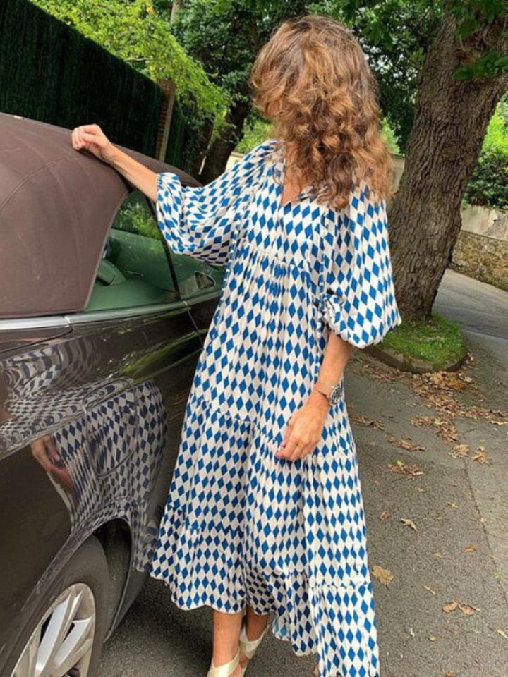 Chic women's summer maxi dress with vibrant print and a figure-flattering waistband design.