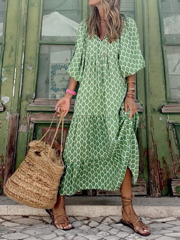 Elegant women's apparel: printed maxi dress with a flattering waistband for a sophisticated look.