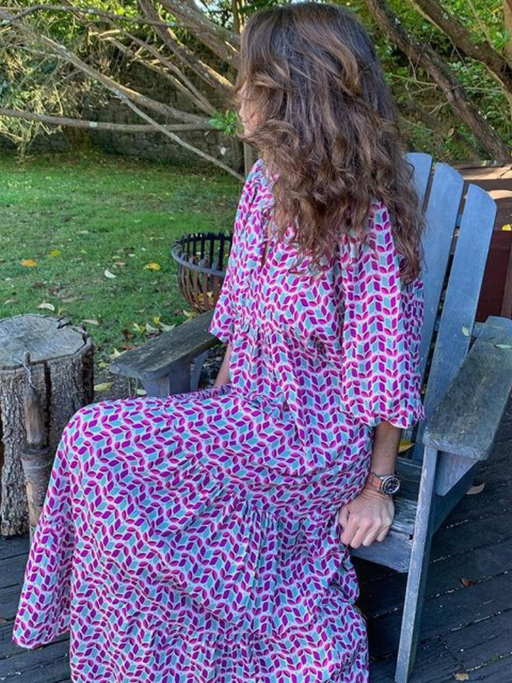 Flowy women's printed maxi dress, designed with a flattering waistband for comfort and style.