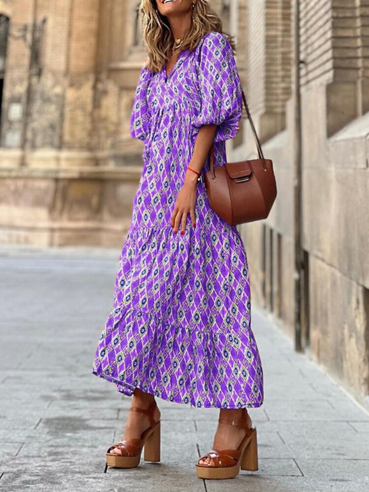 Party-ready printed maxi dress for women, featuring an elegant design and a flattering waistband.