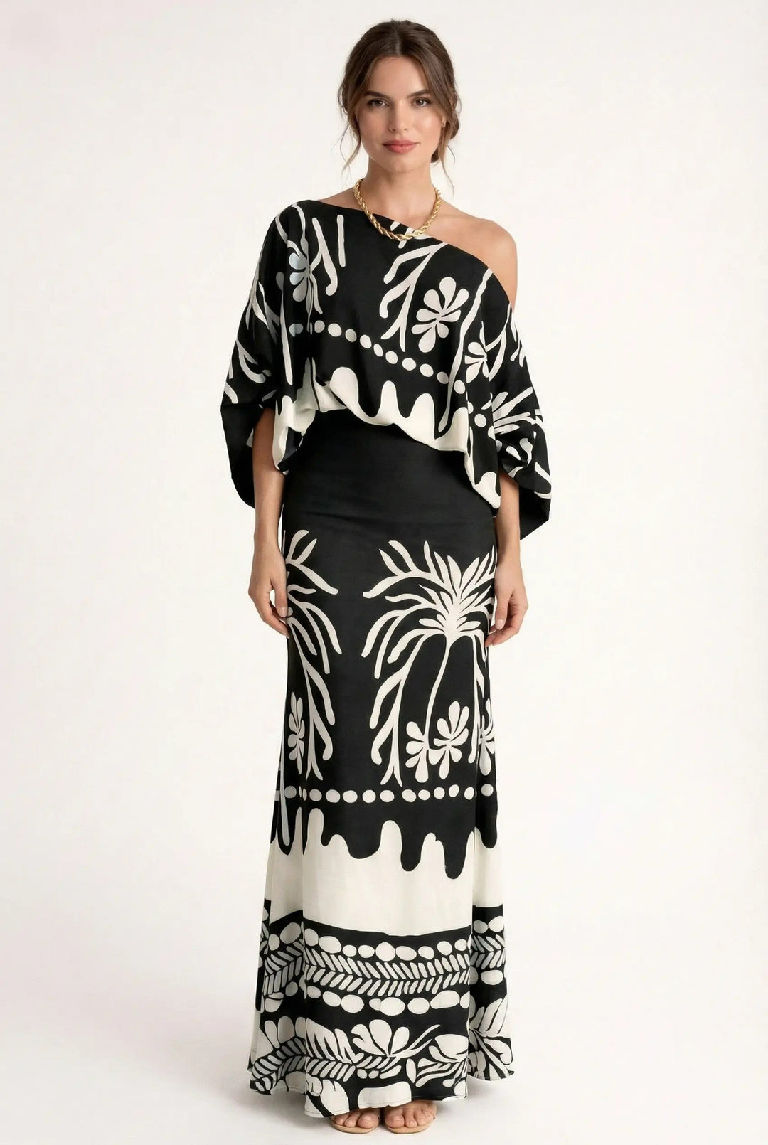 Casual chic women's printed summer outfit with a comfortable maxi skirt and breezy loose-fit blouse.