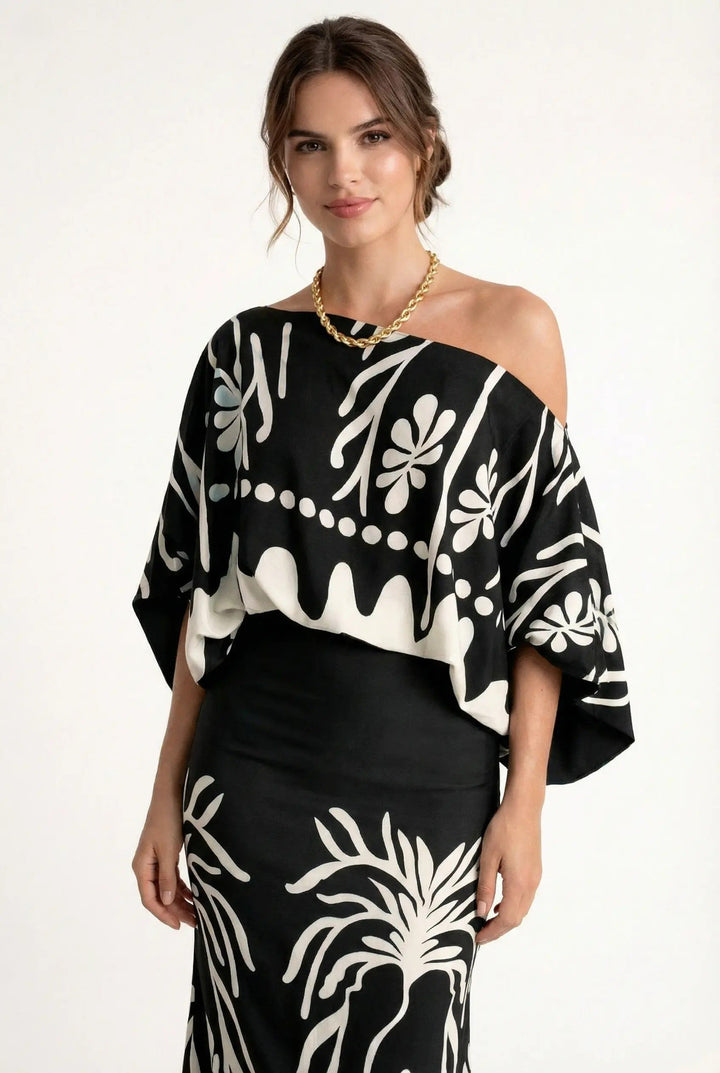 Boho-style women's printed maxi skirt and loose blouse set for a comfortable and stylish summer look.