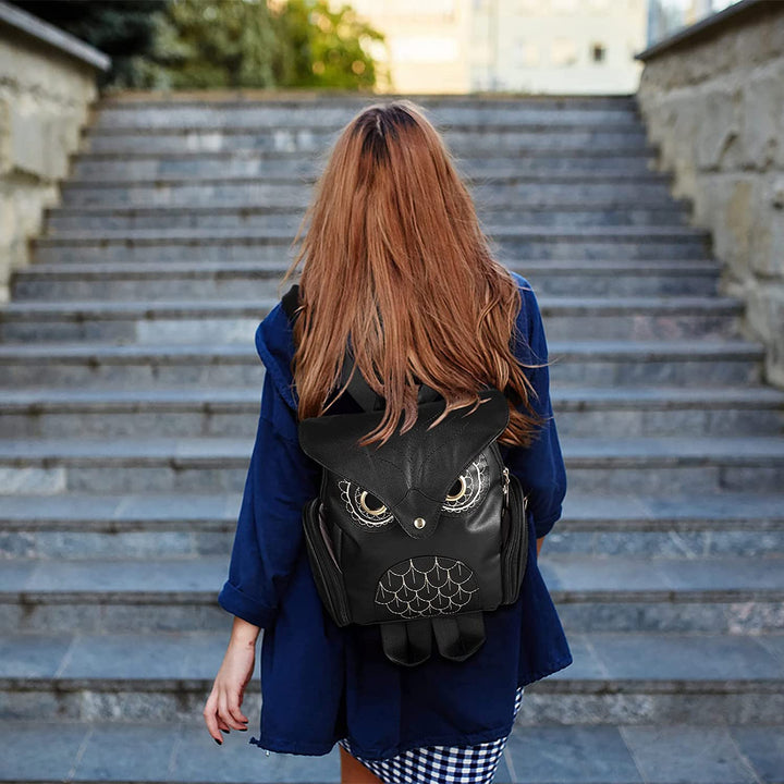Chic women's PU leather backpack showcasing playful owl print & versatile multi-pocket design.