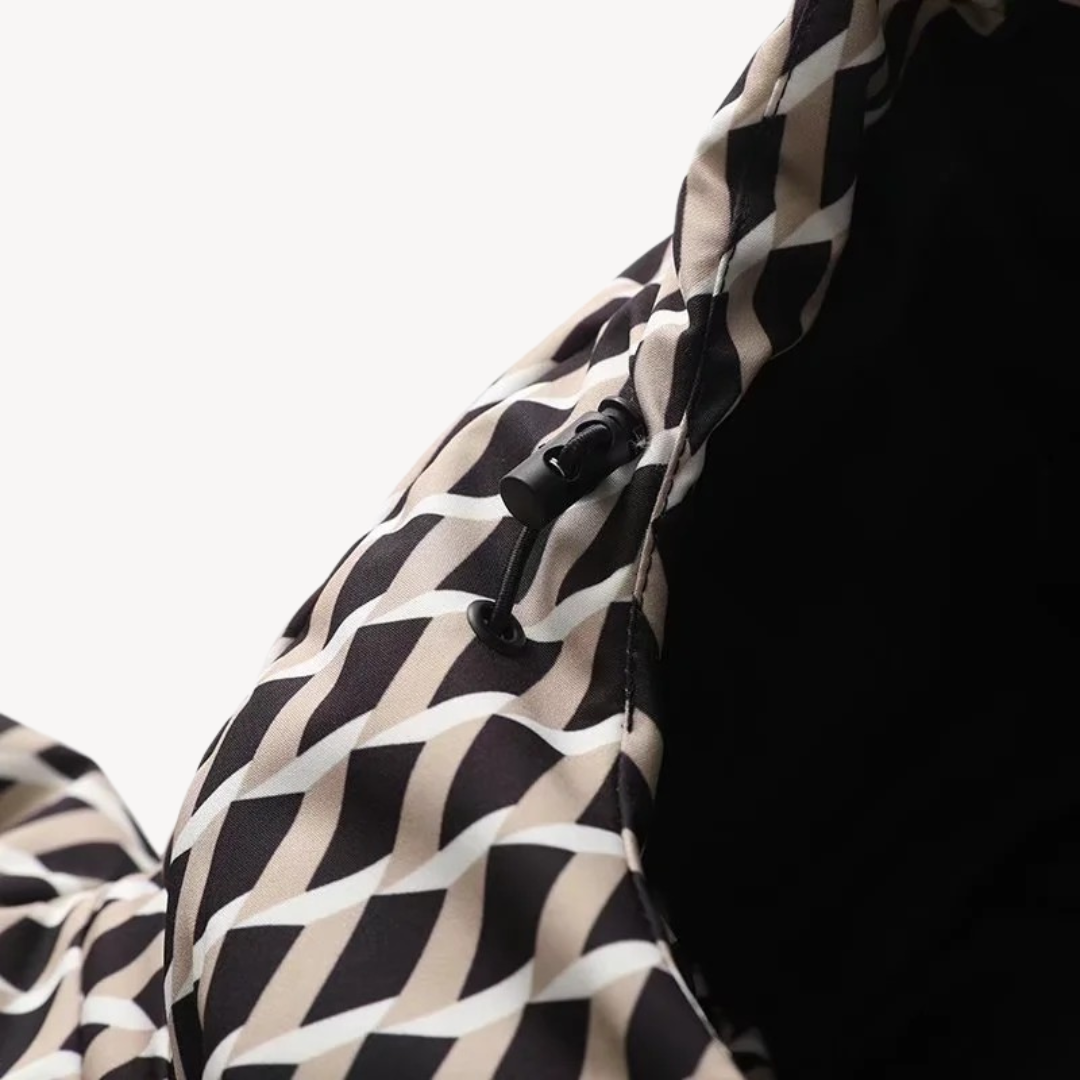 Close-up of the quilted pattern on a women's winter coat, showing seam details