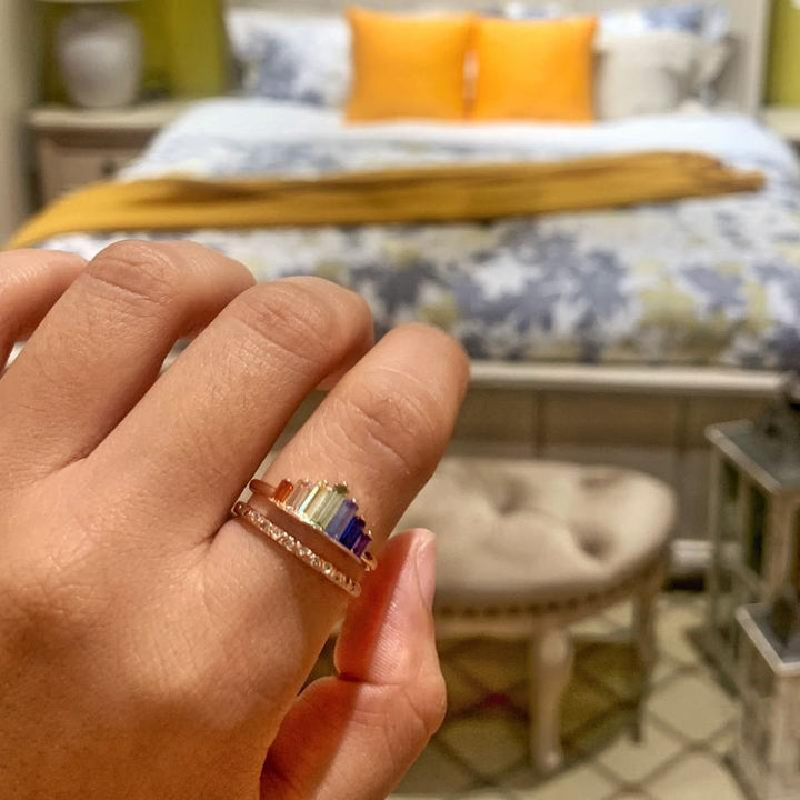 Detail of rainbow micro diamond ring, intricate setting, sparkling colorful gems