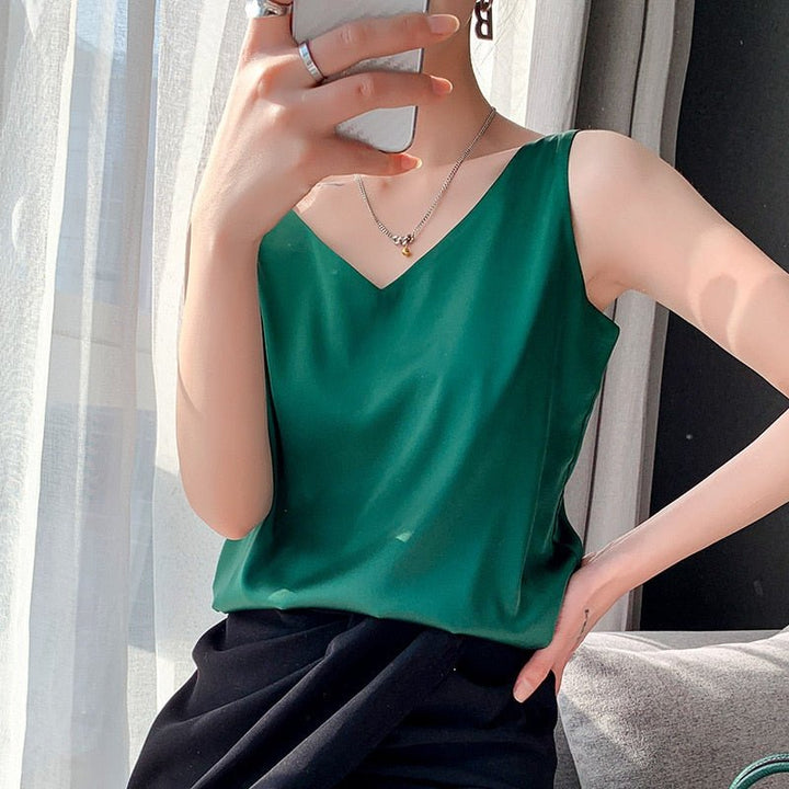Sleeveless V-neck satin blouse in a relaxed fit, versatile for women's fashion.