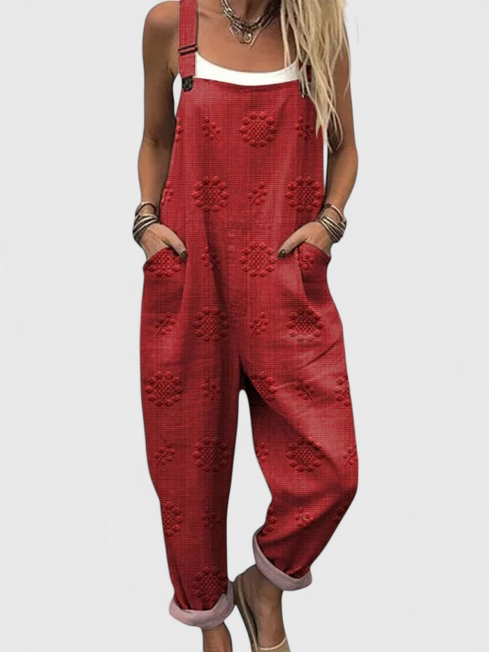 Boho-style women's floral embroidered relaxed fit jumpsuit with pockets & cropped leg for versatile summer wear.