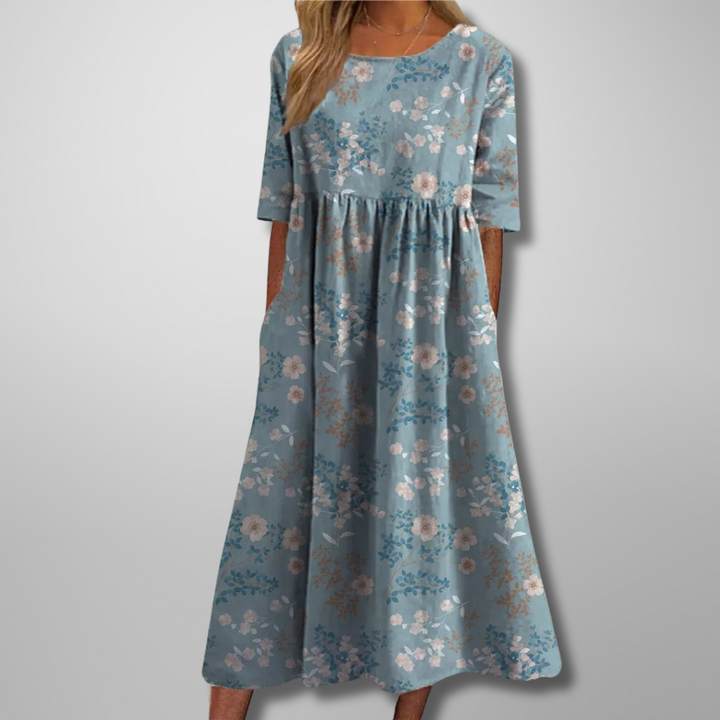 Beautiful women's floral print midi dress with a relaxed, flowy silhouette for summer style.