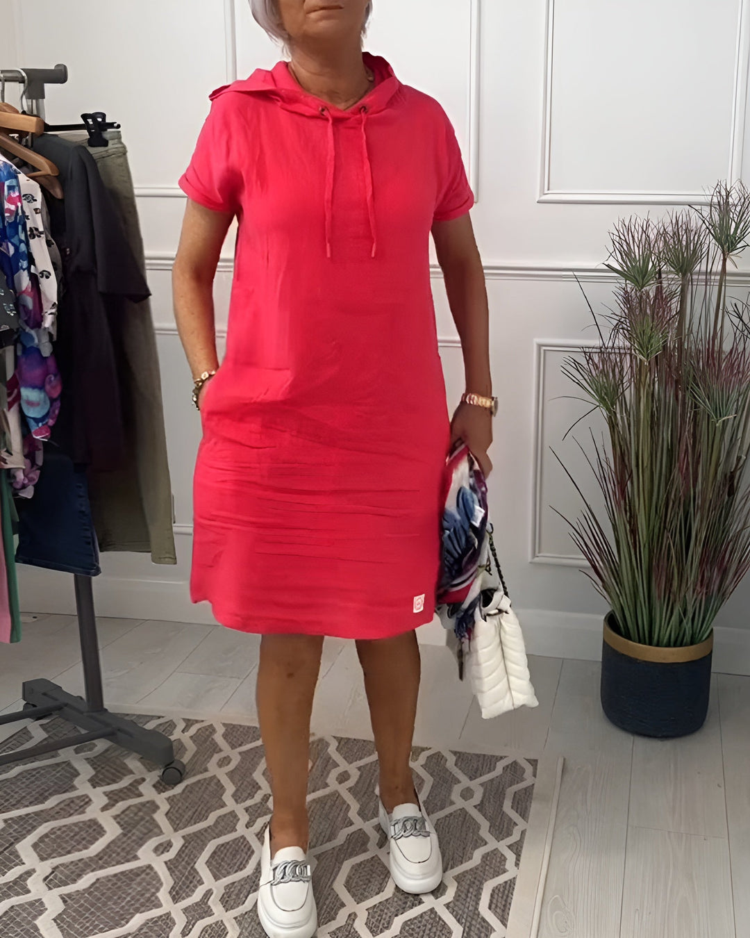 Women's relaxed fit hoodie midi dress with adjustable hood, perfect for casual spring days.