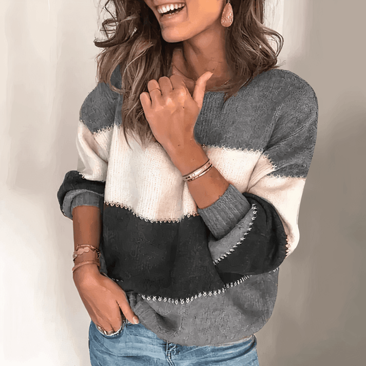 Cozy women's relaxed fit knit pullover sweater with crew neck & ribbed cuffs, perfect for casual wear.