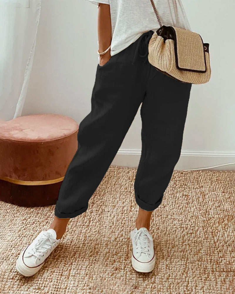 Soft linen women's joggers featuring a relaxed fit & adjustable drawstring waist, ideal for summer comfort.