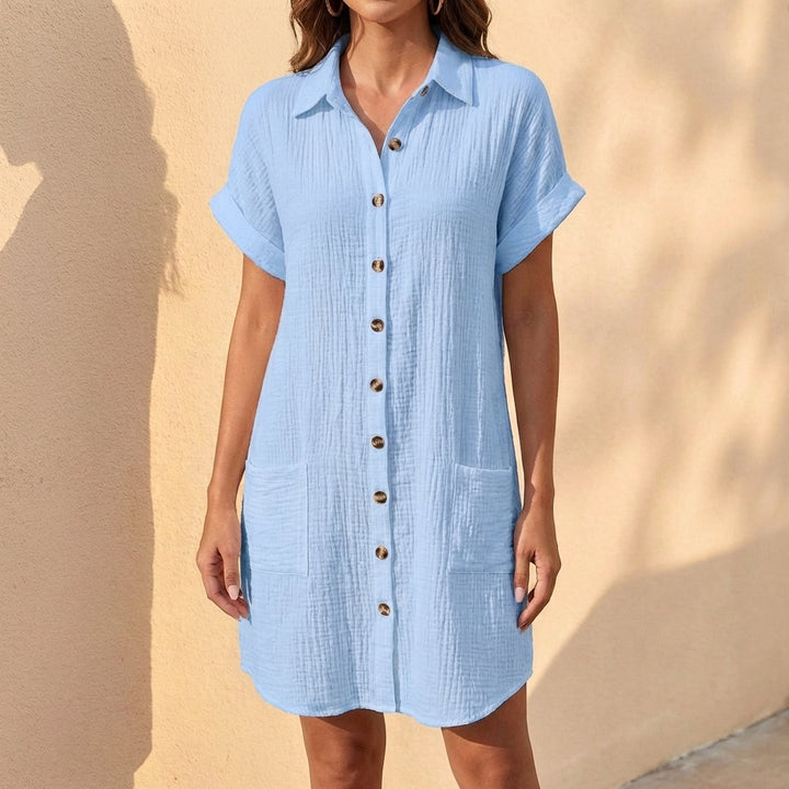 Front view: Women's collared midi shirt dress. Relaxed fit, button-front, cuffed sleeves. Ideal casual summer dress.
