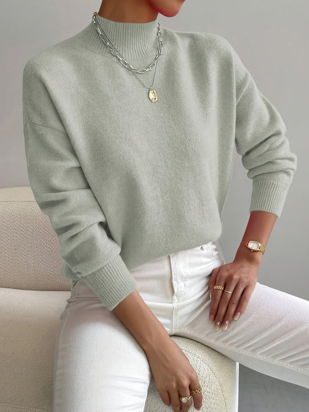 Women's relaxed fit mock turtleneck long sleeve sweater, cozy knit for casual autumn/winter style.