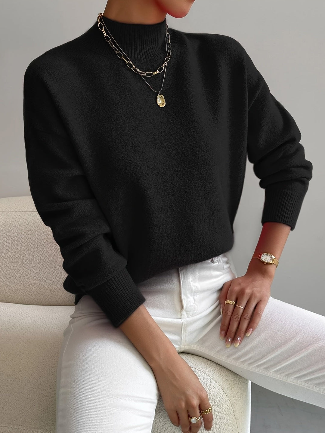Classic women's relaxed fit mock turtleneck sweater with long sleeves, a cozy and chic wardrobe staple.
