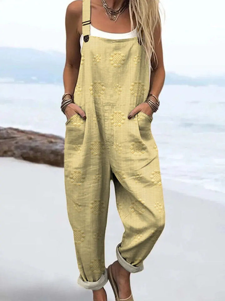 Stylish women's patterned jumpsuit with a relaxed wide-leg silhouette. Features adjustable straps for a perfect fit.