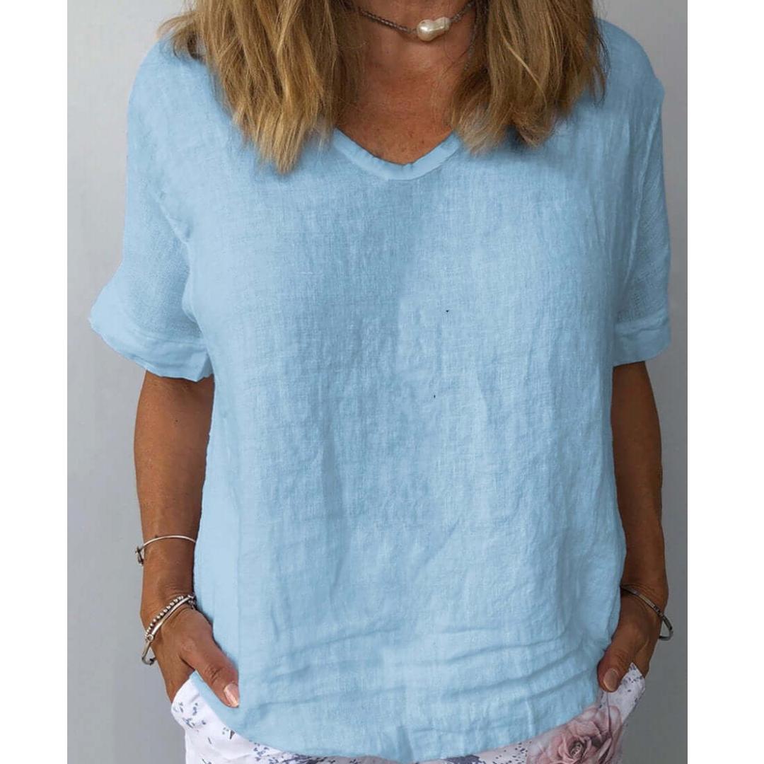 Comfortable women's relaxed fit short sleeve V-neck shirt, ideal for versatile casual wear.