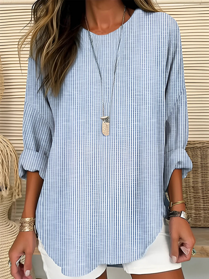 Women's relaxed fit striped long sleeve blouse. Comfortable round neck top for casual everyday fashion.