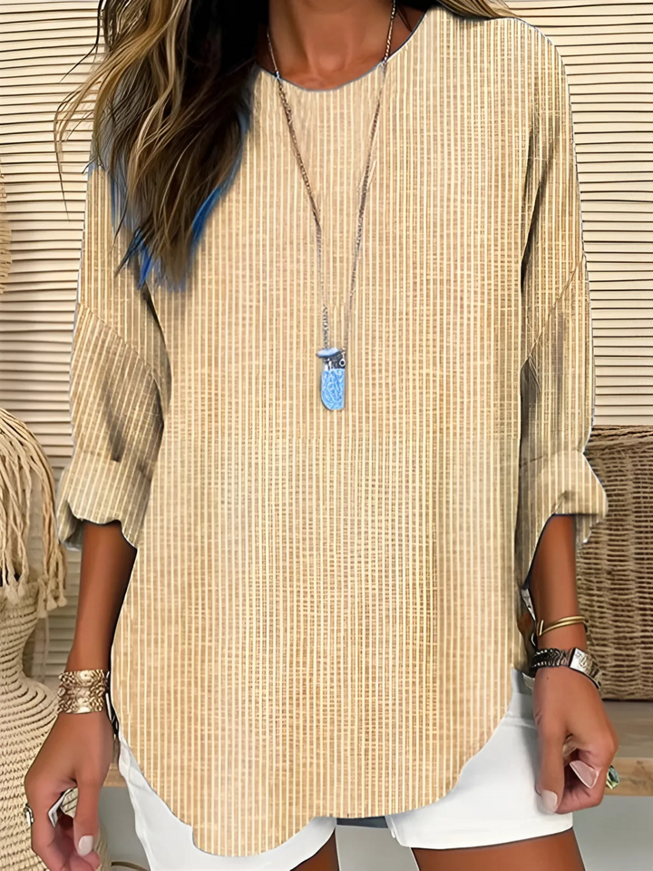 Classic striped long sleeve blouse for women. Versatile relaxed fit top, perfect for comfortable casual wear.