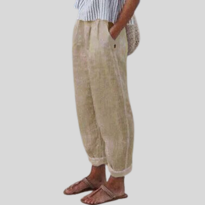 Women's relaxed fit trousers with a stylish folded hem, perfect for casual spring/summer wear.