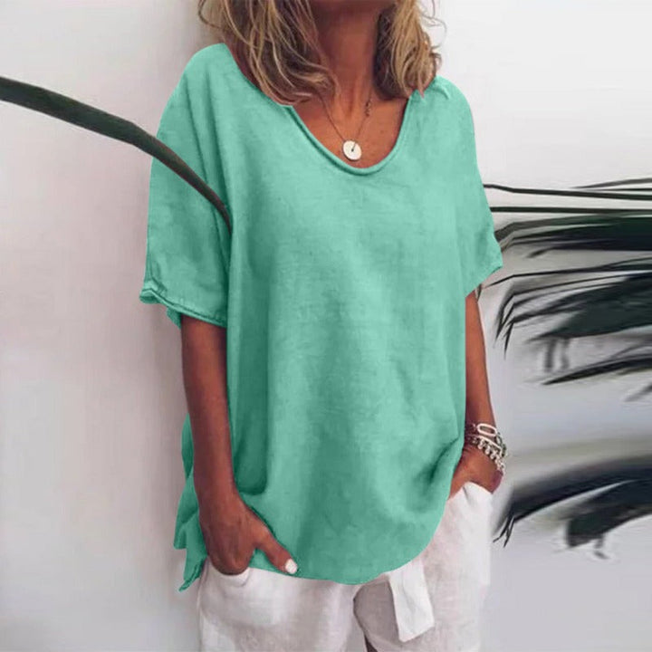Women's relaxed fit elbow sleeve blouse, a chic V-neck summer top suitable for casual everyday wear.