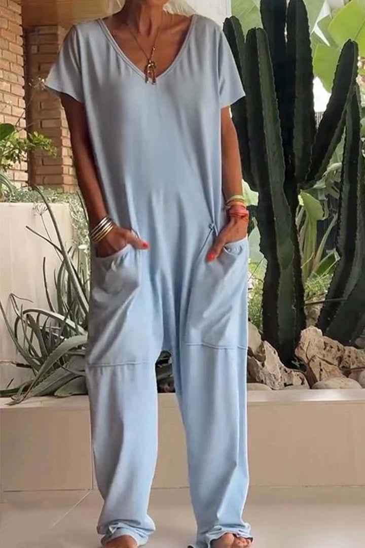 Modern women's casual short sleeve V-neck jumpsuit, offering a relaxed fit and stylish dropped crotch design.
