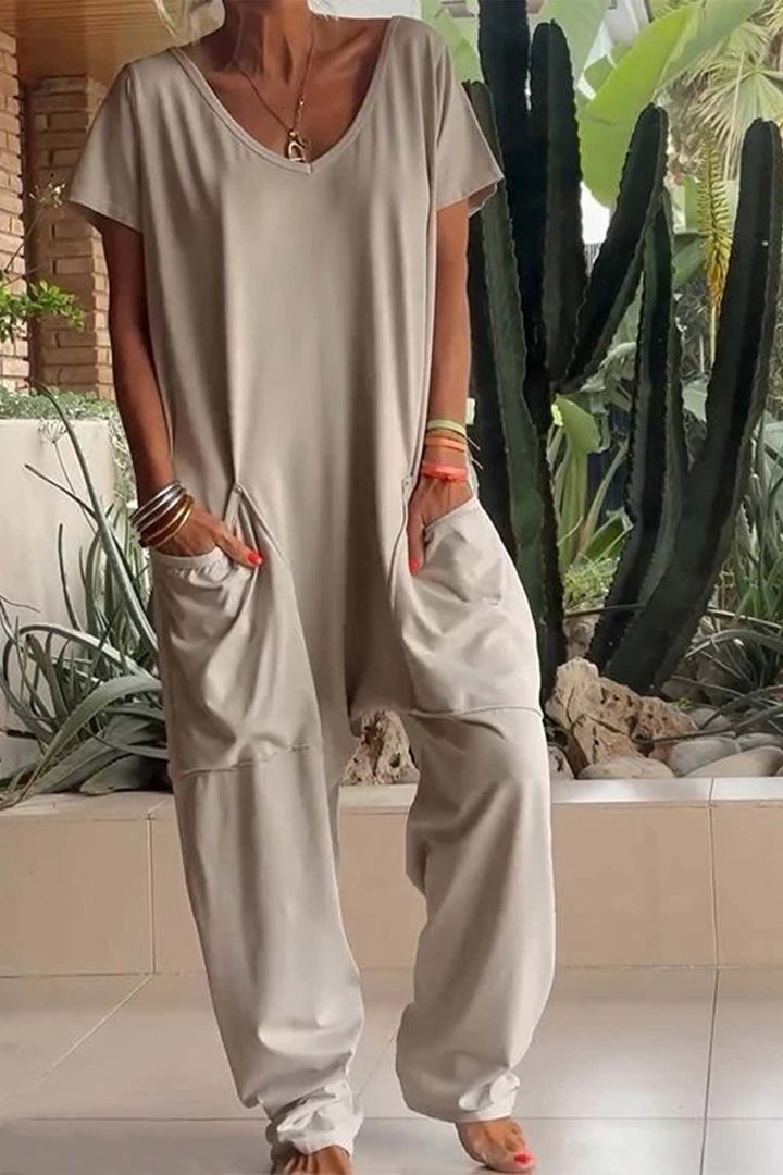 Easy-wearing women's V-neck short sleeve jumpsuit with a relaxed fit and fashionable dropped crotch.