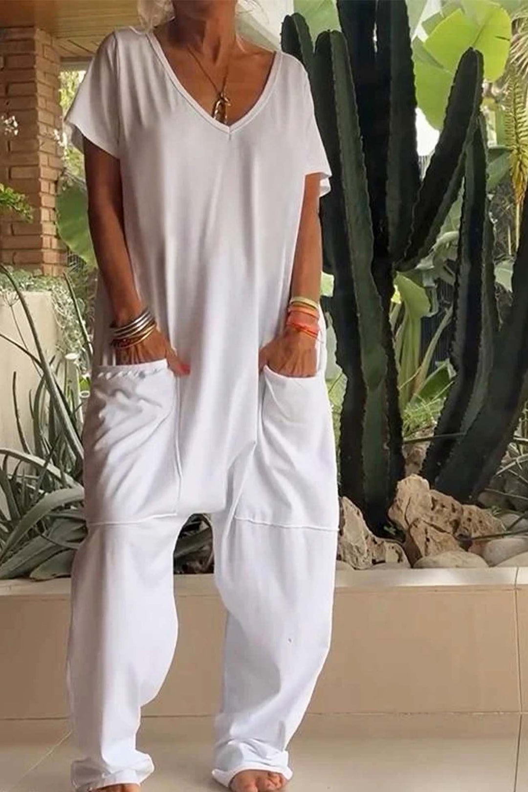 Relaxed V-neck short sleeve jumpsuit for women, a comfortable & stylish one-piece, perfect for summer travel.