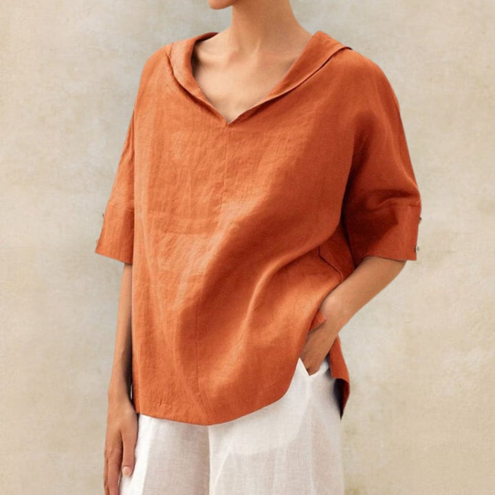 Comfortable women's versatile V-neck top, perfect for spring, featuring a relaxed fit.