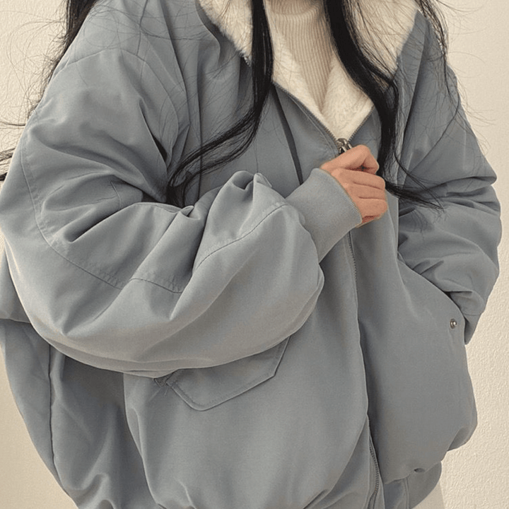 Warm casual jacket for women, navy blue, featuring a comfortable relaxed fit and warm lining.
