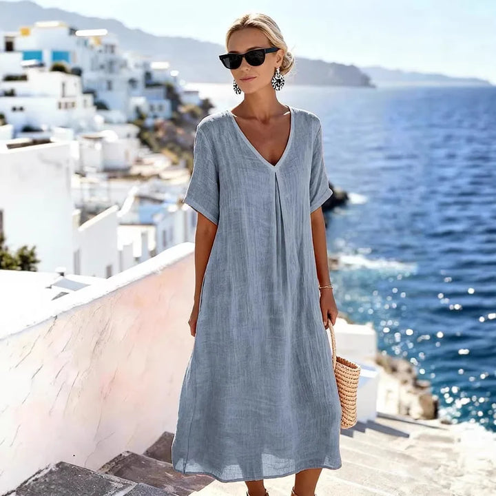 Stylish women's short-sleeve midi dress, V-neck, relaxed fit for everyday comfort.