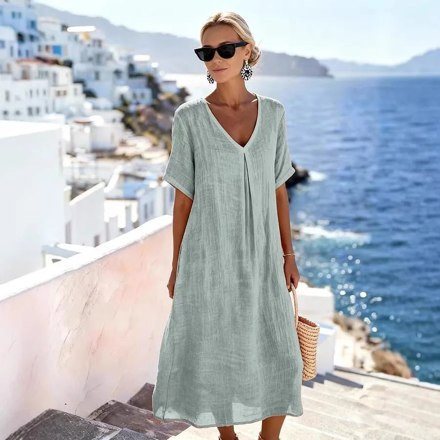 Casual women's summer midi dress, relaxed V-neck, short sleeves, great for vacation outfits.