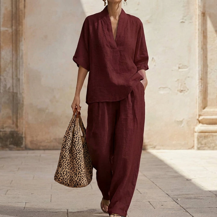 Stylish women's matching two-piece set with relaxed fit V-neck top & wide-leg pants. Ideal for lounge or travel.