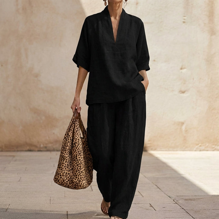 Women's comfortable two-piece set featuring a relaxed V-neck top and wide-leg pants. Versatile summer fashion.