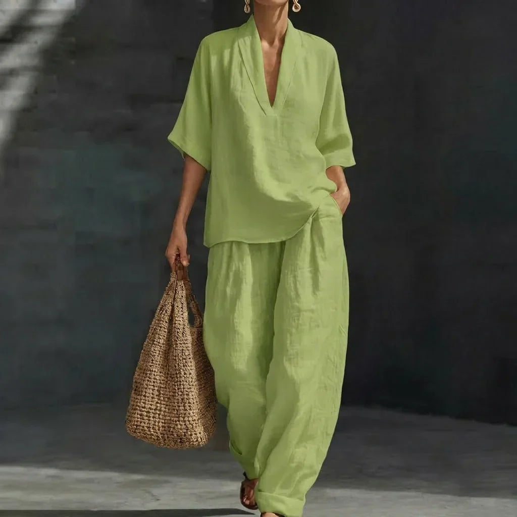 Comfortable women's relaxed fit two-piece set with V-neck top & wide-leg pants. Perfect for casual or travel.
